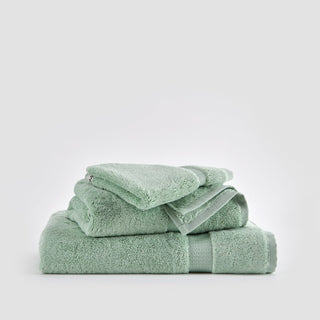 Alba bamboo towel set in light green stacked on white background