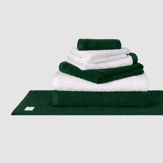 Wabi Sabi towel set in white and forest green stacked display against neutral background