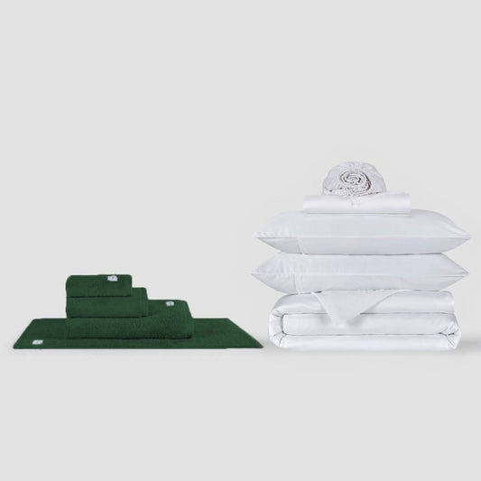 Green towel set and white bedsheet set stacked on white background by Momo Cotton